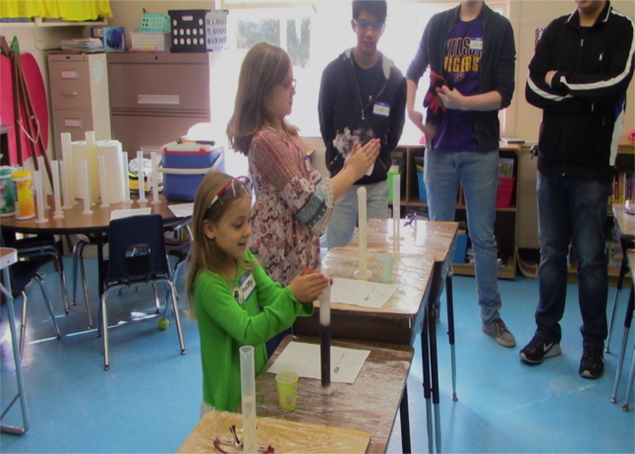 Young students having fun with science